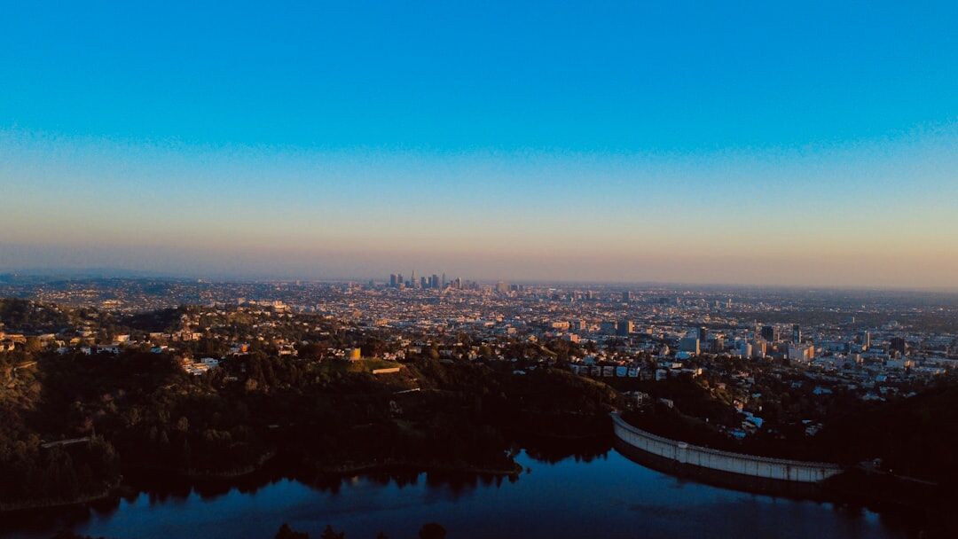 Modern drone flying over city skyline aerial view